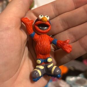 Vintage sesame street elmo with rollerskates